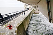 Tourists on a flood barrier,Netherlands