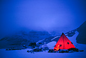Illuminated tent in semi-darkness,Antarc