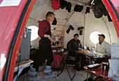 Film crew in Antarctic shelter