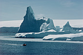 Iceberg in front of island icecap