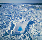 View of compacted icebergs in the sea by Greenland