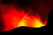 View of Mount Etna erupting at night