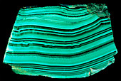 A polished slab of malachite