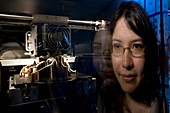 Researcher observing a 3-D printer