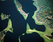 Aerial view of a kettle lake with forested islands