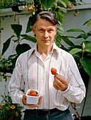 Robert Irvine with hydroponic strawberries