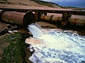 Pipe discharging industrial effluent into the sea