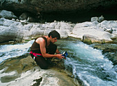 Testing river water for radiation levels