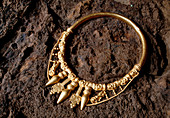 View of a golden Celtic necklace during excavation