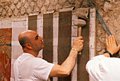 Archaeologists with a fresco,Pompeii