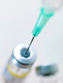 Needle inserted into a vaccine vial