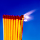 Close-up of a set of matches igniting