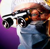 Surgeon with magnifying lenses for microsurgery