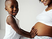 Pregnant woman and son