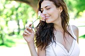 Woman smelling a flower