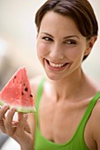 Woman eating watermelon