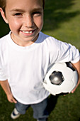 Boy holding a football
