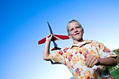 Boy playing with a model aeroplane