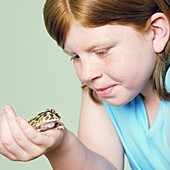 Girl with her pet toad