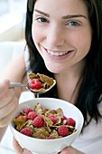Woman eating healthy cereal