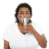 Woman using a nebulizer