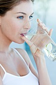 Woman drinking water with lime