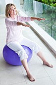 Senior woman using an exercise ball