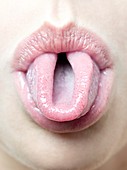 Woman rolling her tongue