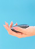 Stone in a woman's hand