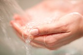 Woman washing her hands