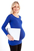 Pregnant woman with a laptop