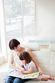 Mother and daughter reading