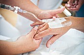 Nurse preparing a patient for an IV line