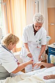 Nurse preparing a patient for an IV line