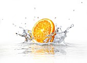 Orange splashing into water,artwork