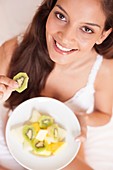 Woman eating fruit