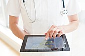 Nurse using a tablet computer