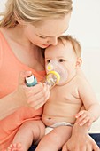 Baby using an inhaler