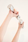 Woman using hand weights