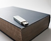 Flash drive and old book