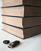 USB flash drive and old books