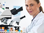 Scientist with microscope