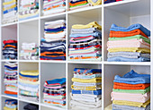 Folded towels on shelves