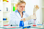 Female technician working in lab