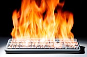 Computer keyboard in flames