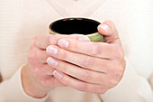 Woman holding mug