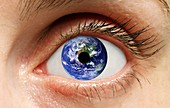 Human eye with planet earth