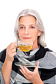 Mature woman drinking herbal tea