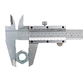 Caliper measuring a nut