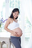 Pregnant woman touching her tummy
